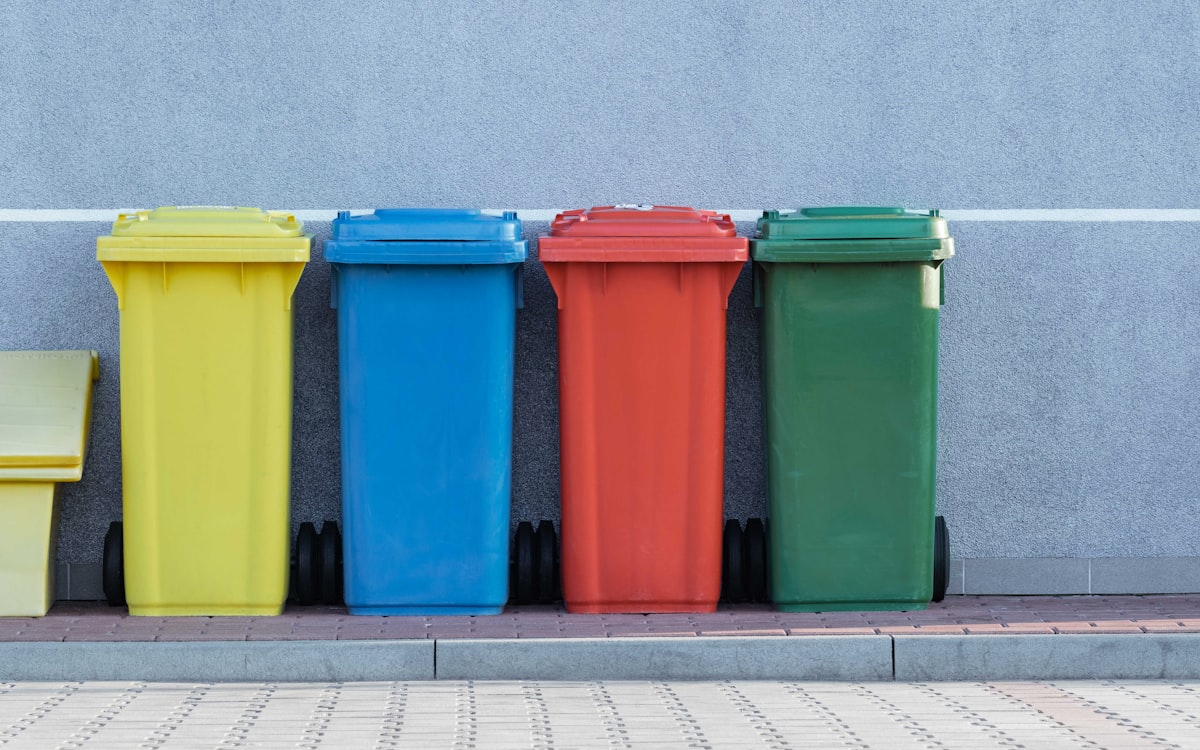 Colorful waste bins lined up after a cleanout